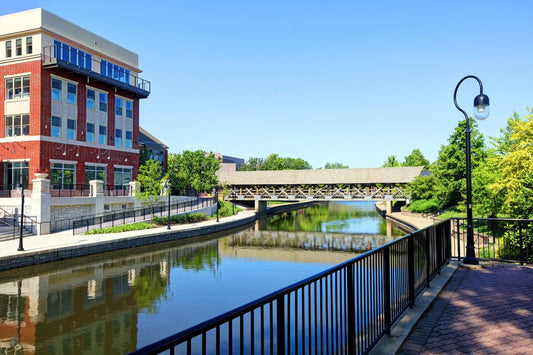 Naperville Riverwalk in spring with trees, water, and walking path