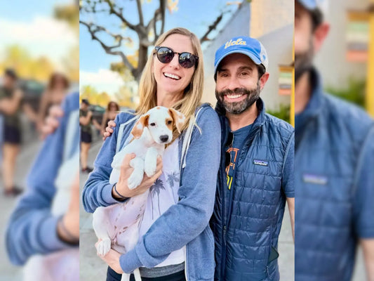 Couple holding their newly adopted puppy, celebrating a successful adoption on National Adopt a Shelter Pet Day